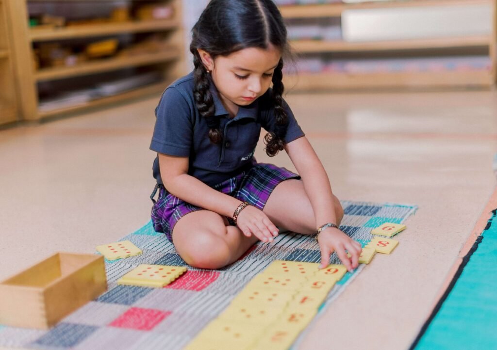 Purpose based school in bangalore ekya nava kid playing crafts